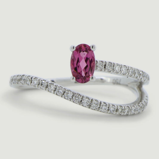 White gold two row swirl ring set with an oval pink tourmaline and micro-pavé set band - view from the top