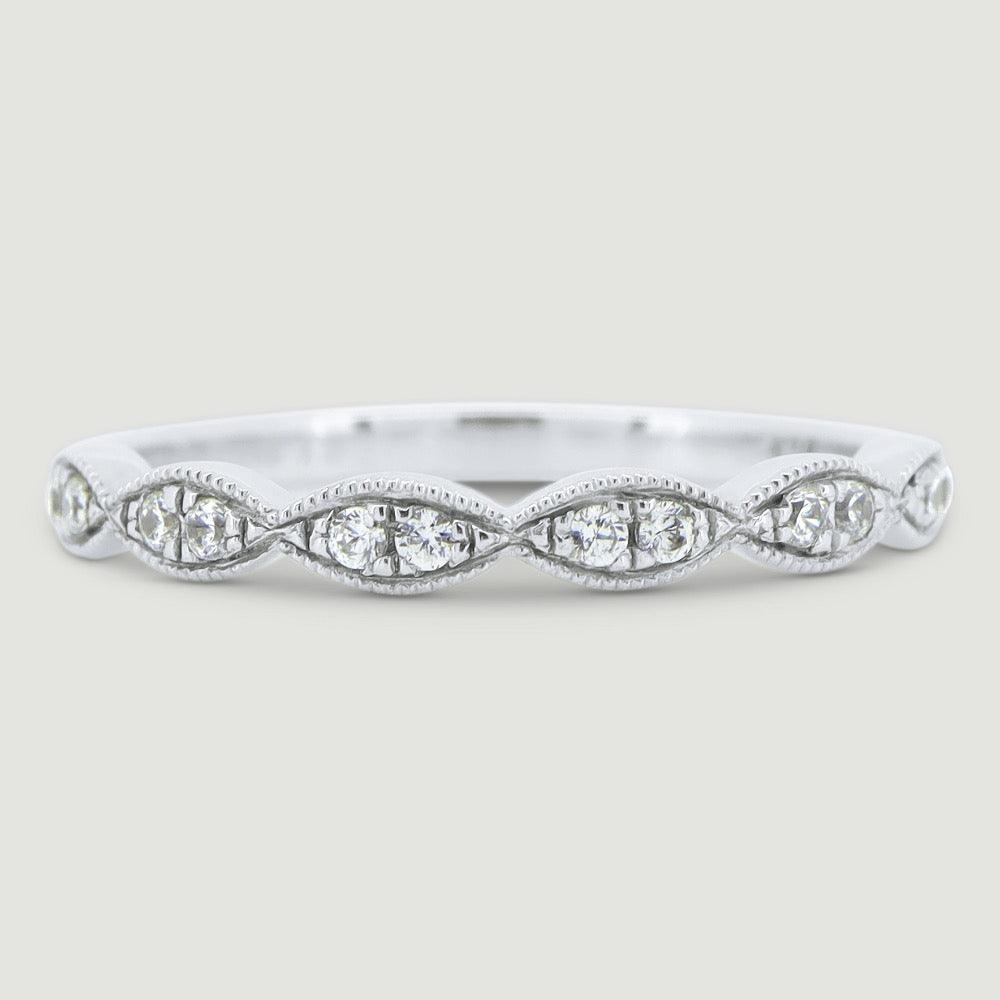 Fancy diamond ring set with 2 stones grain set into each marquise shaped section 18WG
