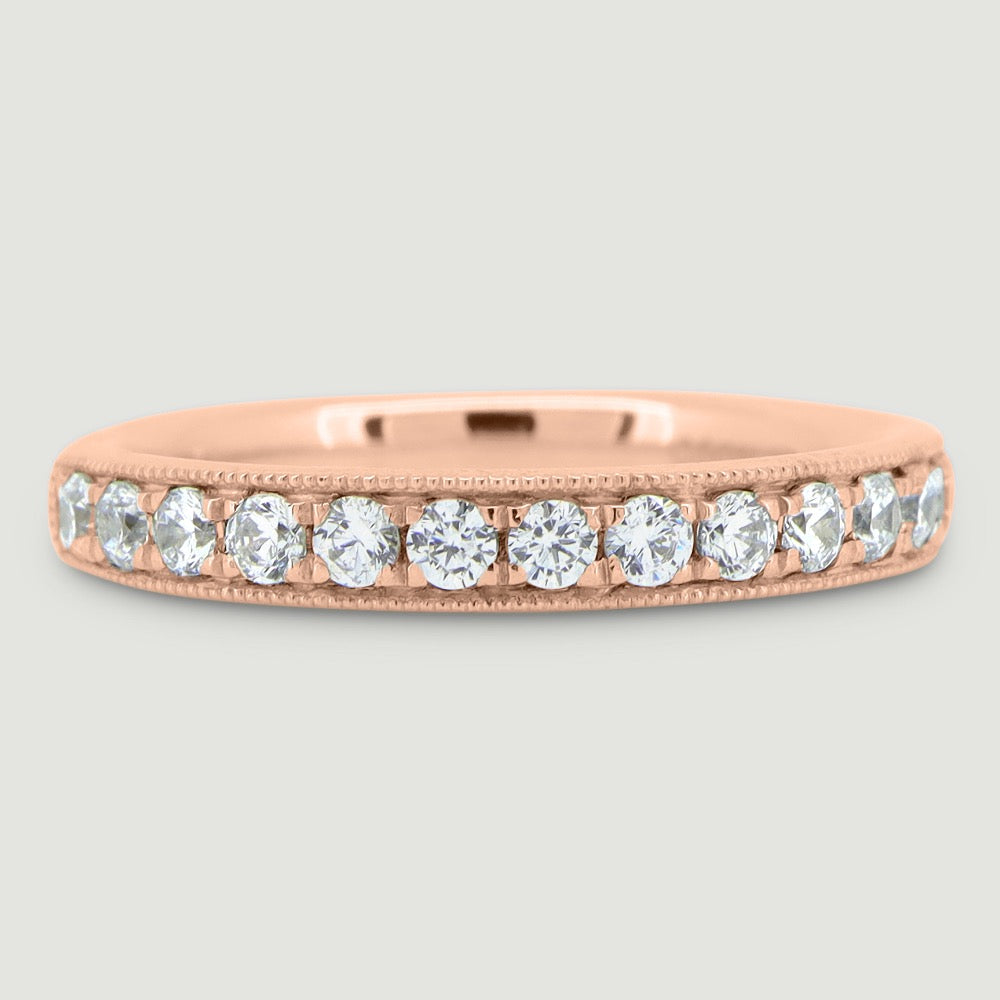 3mm court shape ring grain set with round diamonds and a beaded edge 18RG