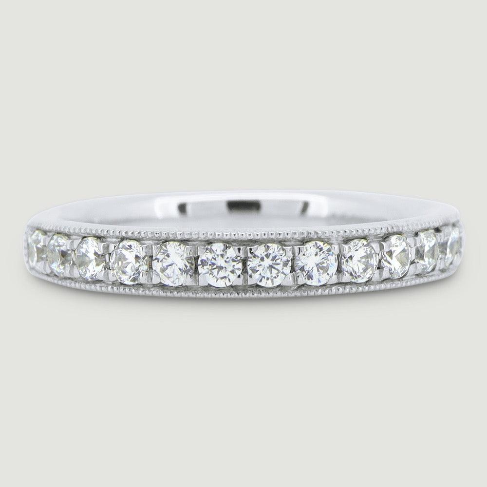 3mm court shape ring grain set with round diamonds and a beaded edge 18WG
