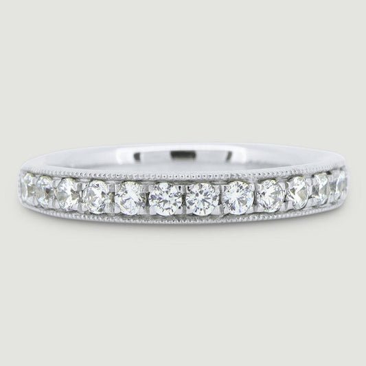 3mm court shape ring grain set with round diamonds and a beaded edge 18WG