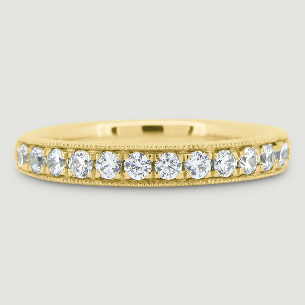 3mm court shape ring grain set with round diamonds and a beaded edge 18YG
