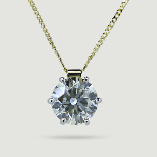 6 claw solitaire diamond pendant in 18ct yellow gold and platinum from front