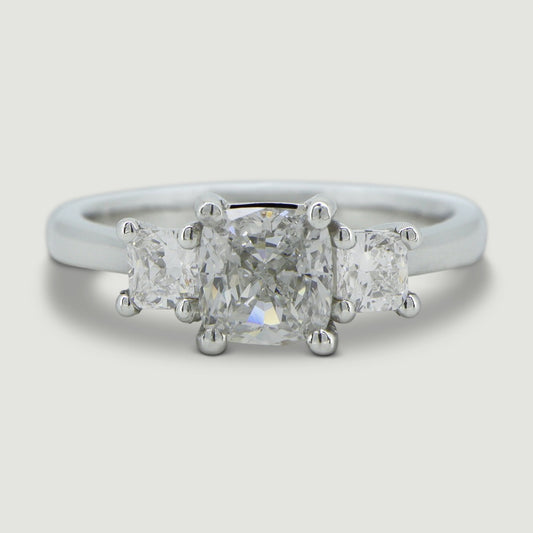 Platinum trilogy diamond engagement ring, claw set with three cushion shaped diamonds - view from the top
