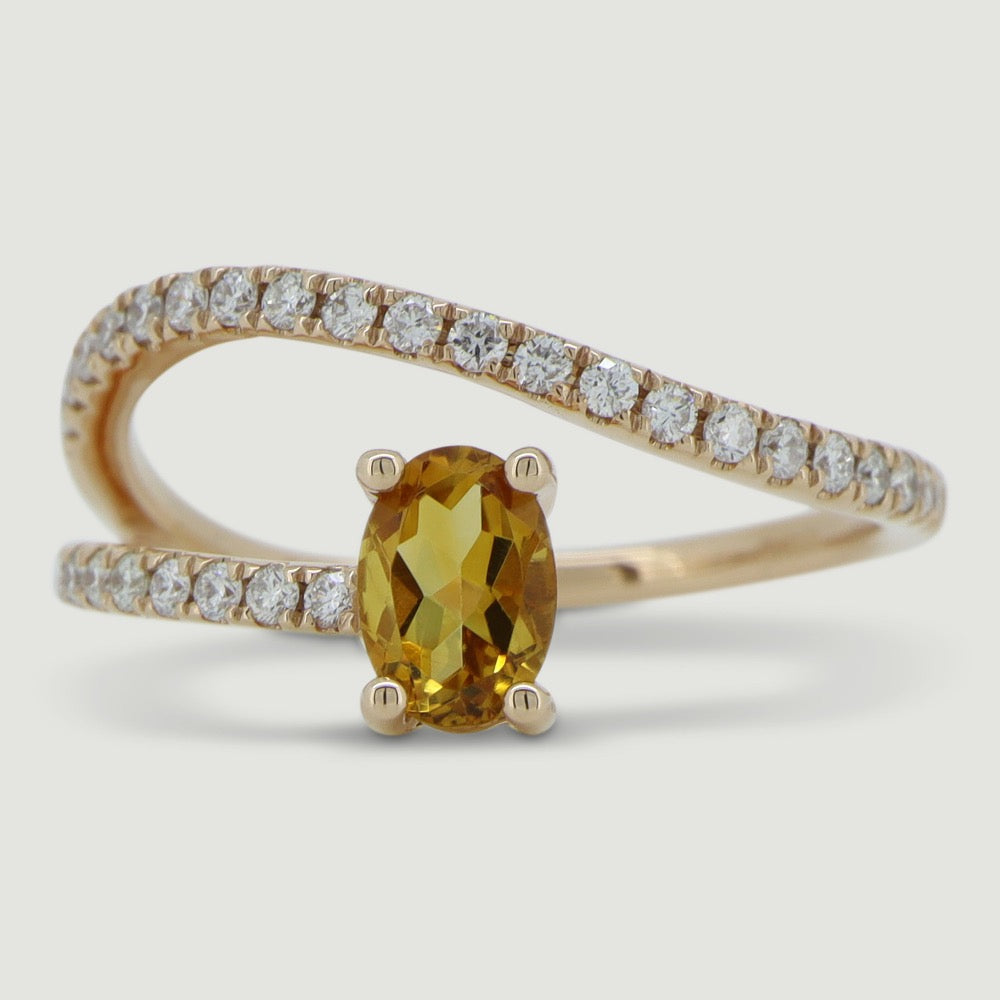 Rose gold two row swirl ring set with an oval citrine and micro-pavé set band - view from the top