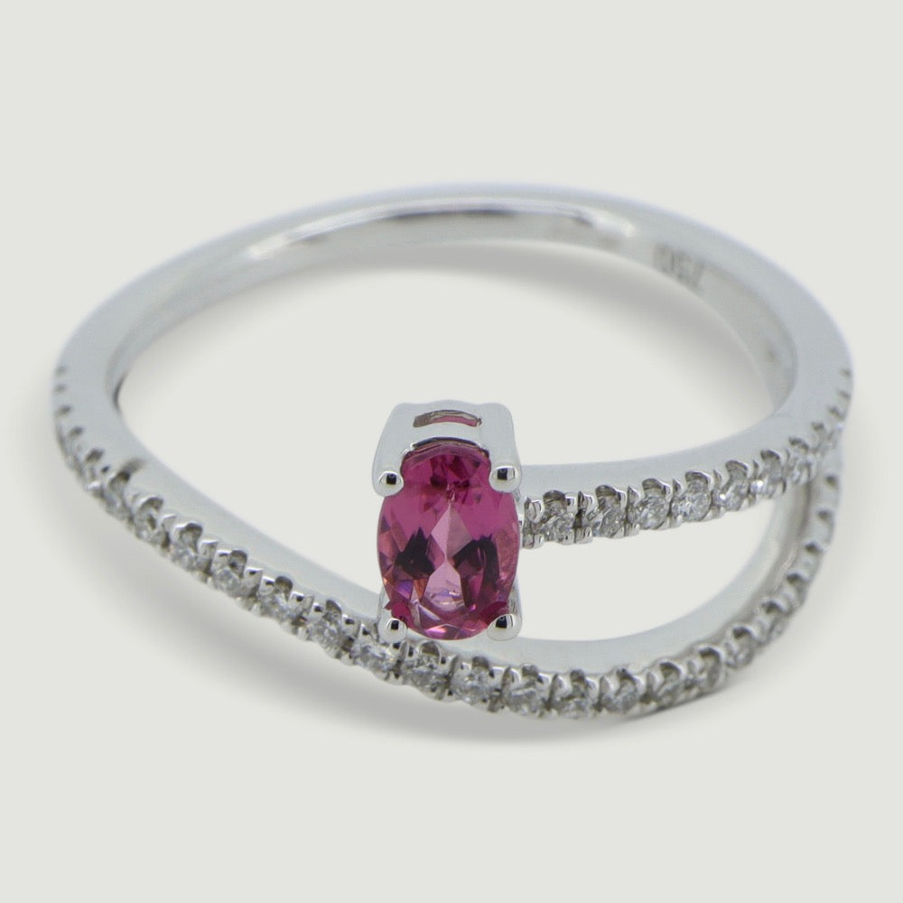 White gold two row swirl ring set with an oval pink tourmaline and micro-pavé set band - view from an angle