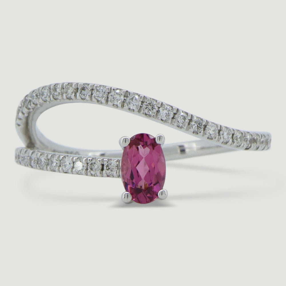 White gold two row swirl ring set with an oval pink tourmaline and micro-pavé set band - view from the top