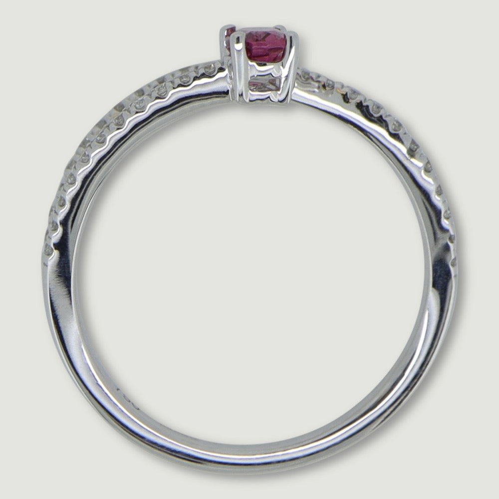 White gold two row swirl ring set with an oval pink tourmaline and micro-pavé set band - view from the side