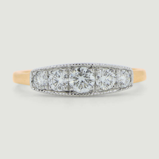 Five stone vintage style ring the round diamonds are grain set in a box with a mill grained edge the band of the ring is a little wide and plain - view from the front