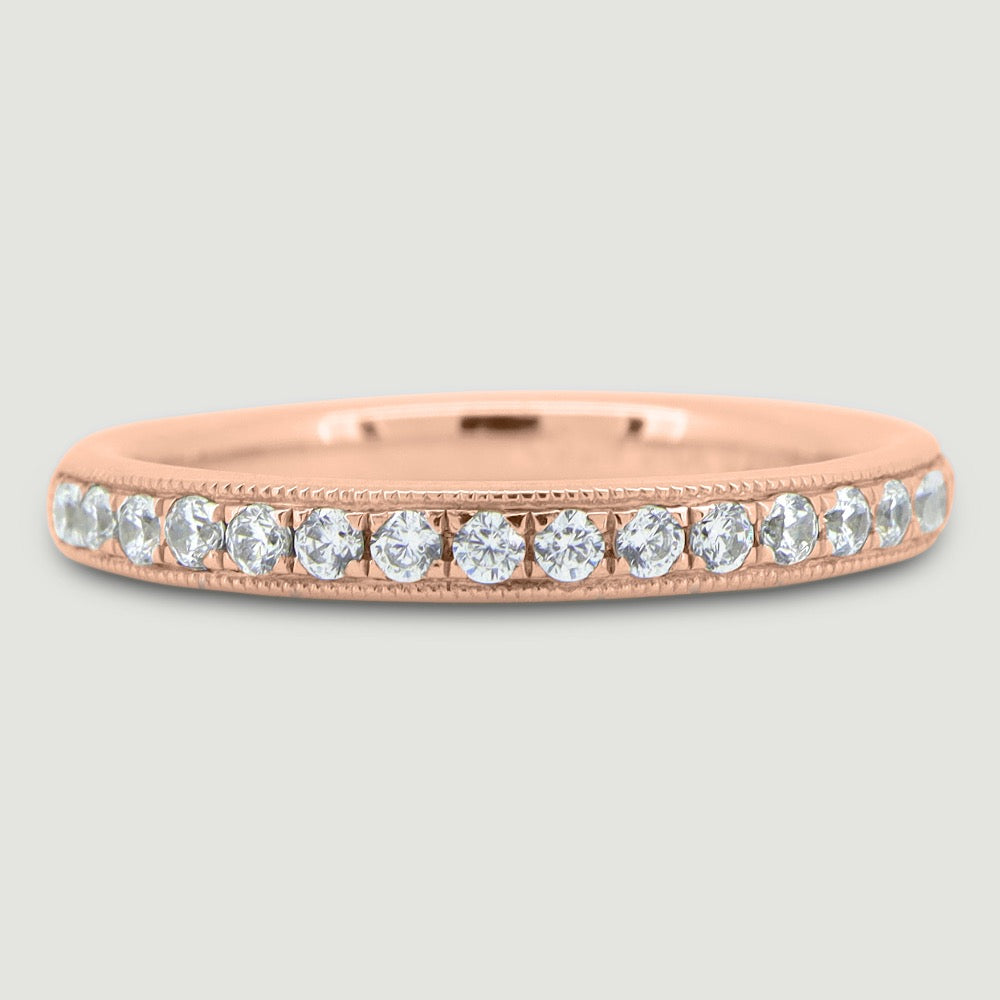 Court shaped 2.5mm band gain set with round brilliant diamonds with a beaded edge 18RG