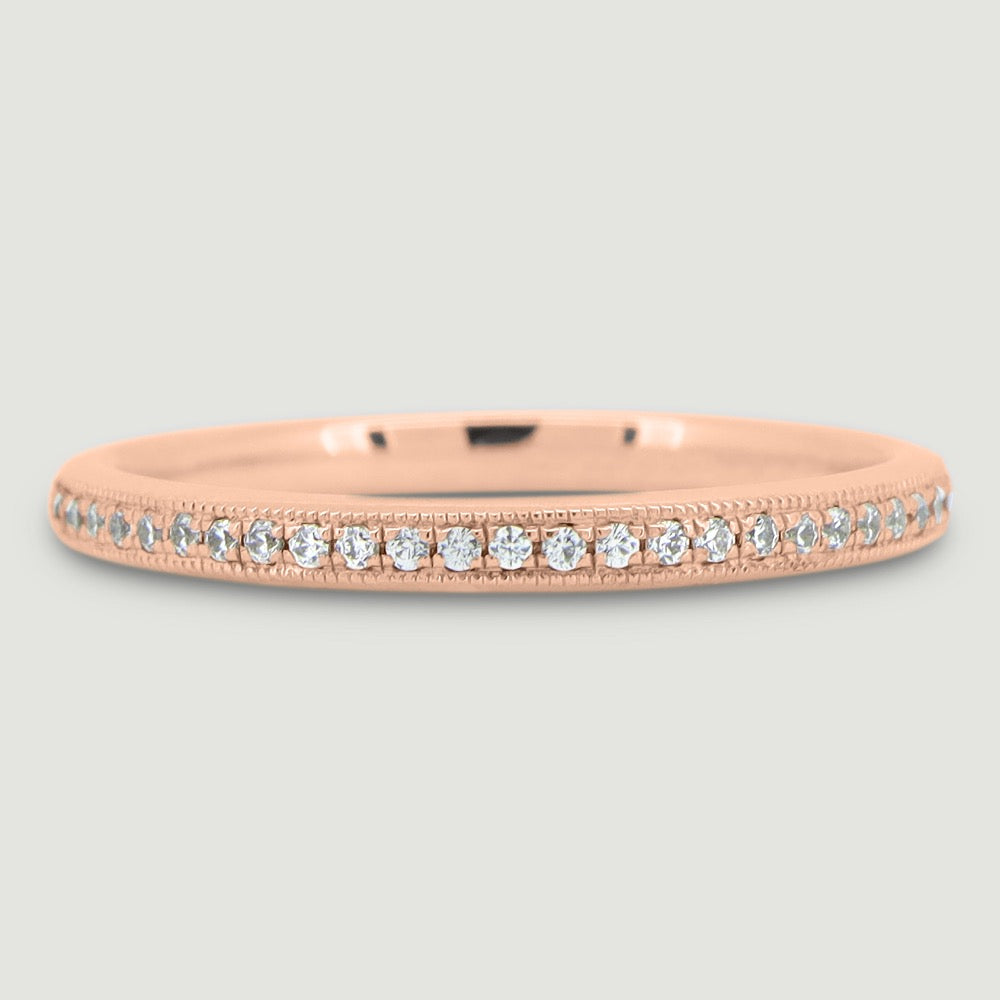 Court shaped band gain set with round brilliant diamonds with a beaded edge 18RG 3mm