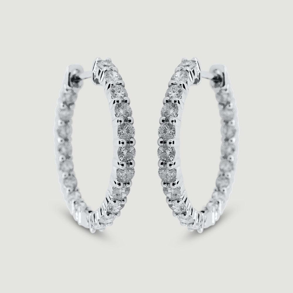 White gold claw set diamond hoop earrings - view from the front