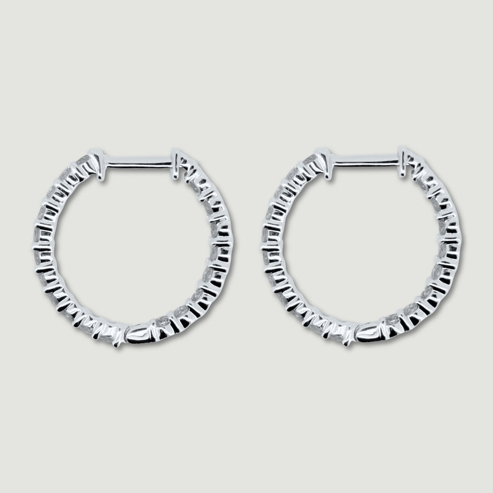 White gold claw set diamond hoop earrings - view from the side