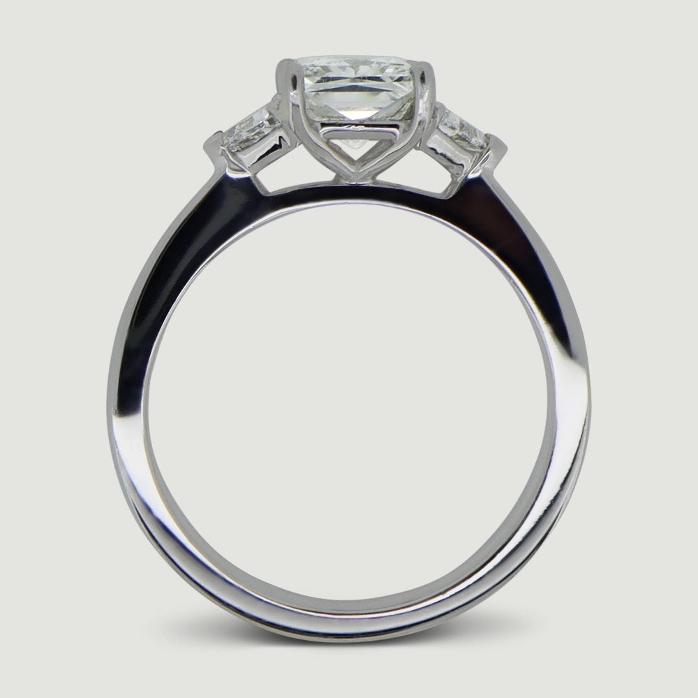 Princess cut and trillion cut trilogy diamond ring - view from the side